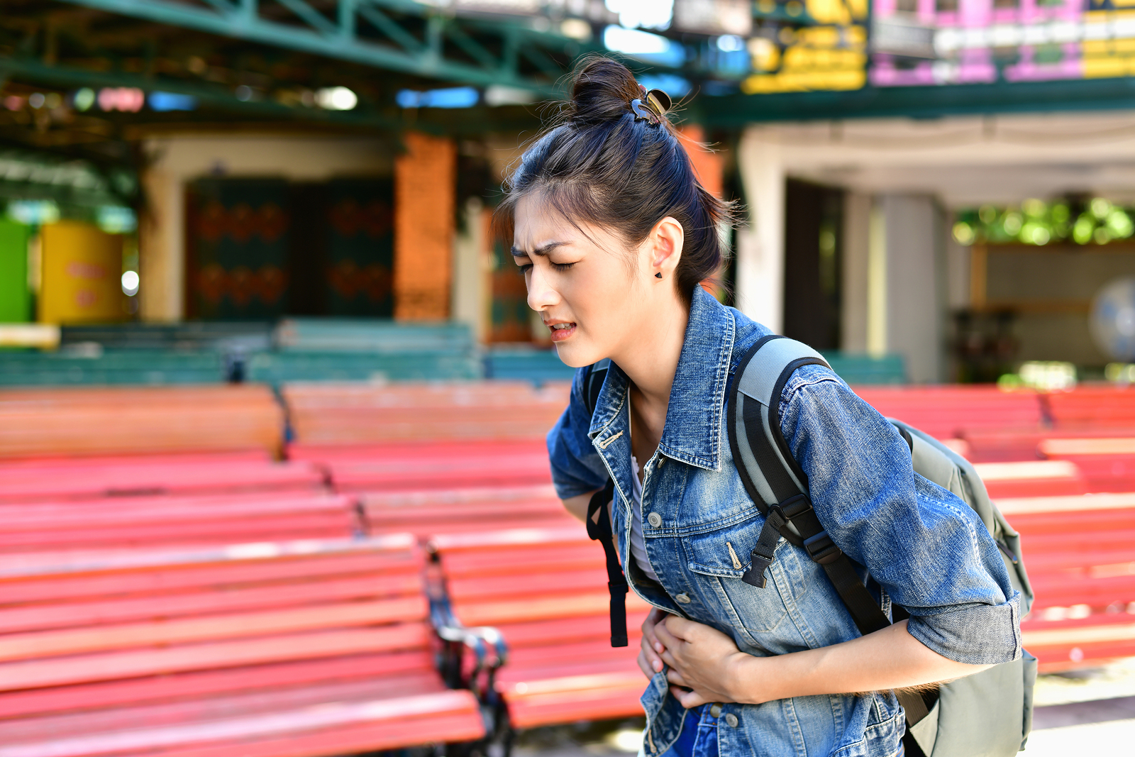 Young woman with stomach ache.