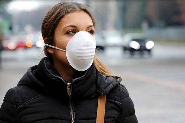 Woman wearing mask on street