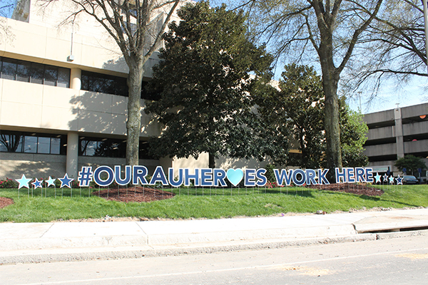 Our AU Heroes signage