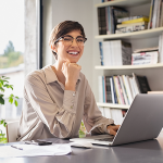 Woman smiling and working from home