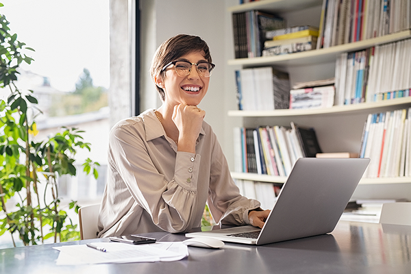 Woman smiling and working from home