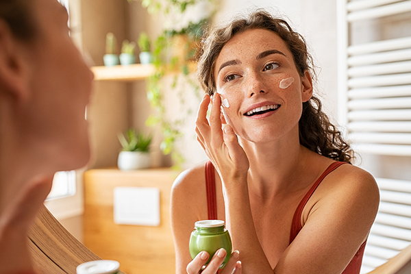 Woman taking care of skin at home