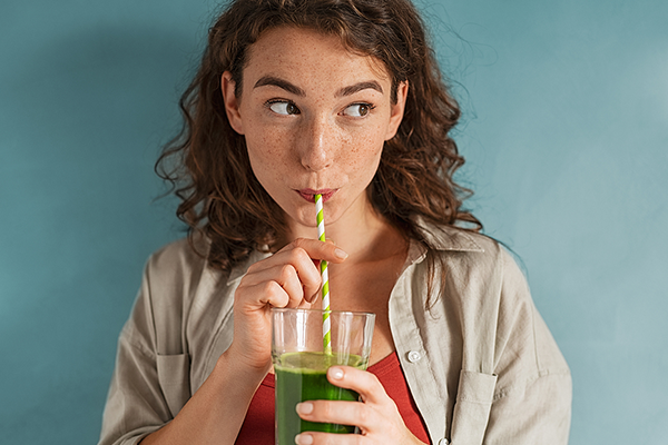 Woman drinking a homemade juice