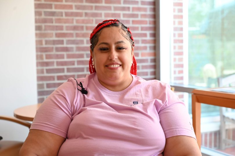 Noemi Nieves sits inside the Meditation Retreat Suite inside the Georgia Cancer Center's Outpatient Services - Laney-Walker Clinic