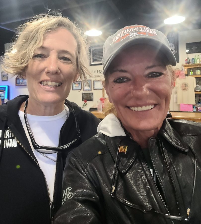 Shellie Smitley and her sister flash their smiles while taking a selfie.