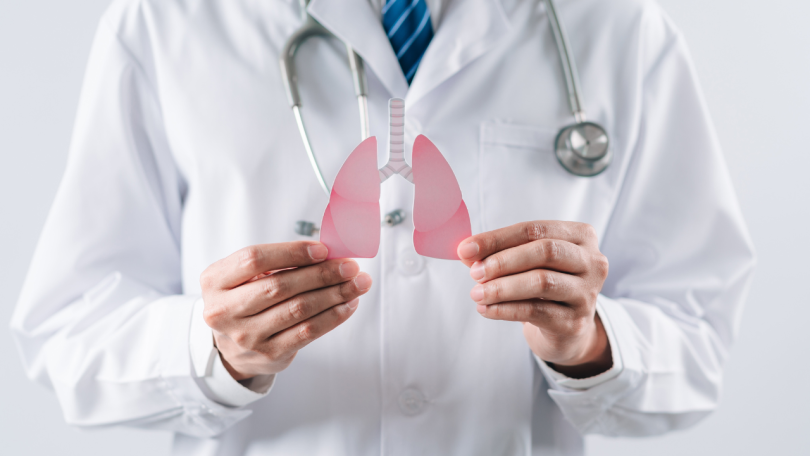 A doctor holds a pair of lungs to bring awareness to lung cancer