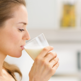 woman drinking supplement