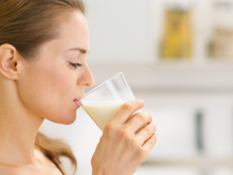 woman drinking supplement