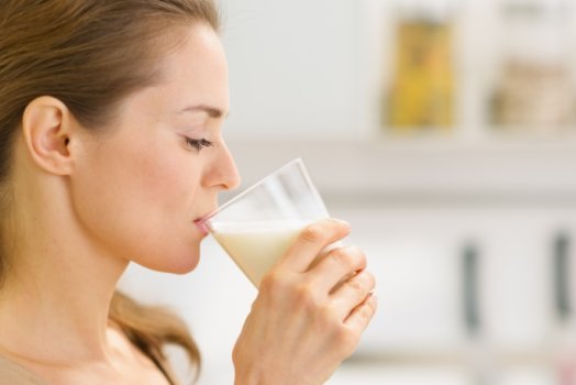 woman drinking supplement