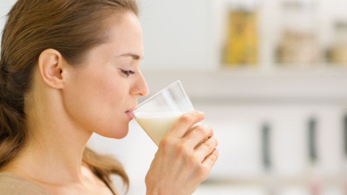 woman drinking supplement