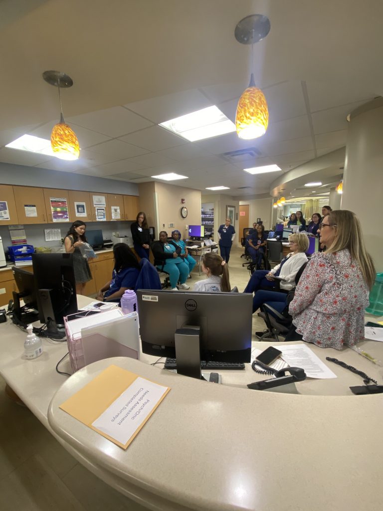girl speaking to nurses