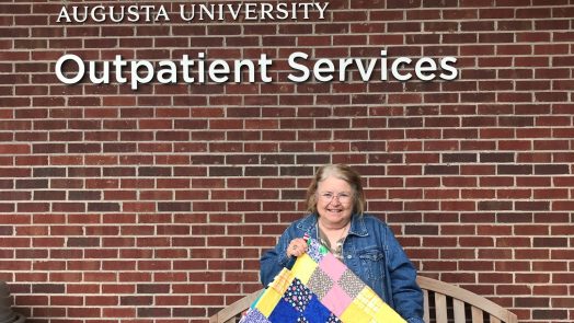 woman holding a blanket