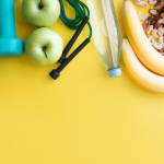 weights, fruit, on a yellow background