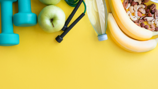 weights, fruit, on a yellow background