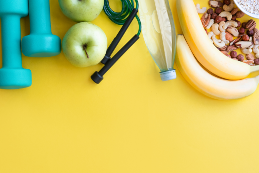 weights, fruit, on a yellow background