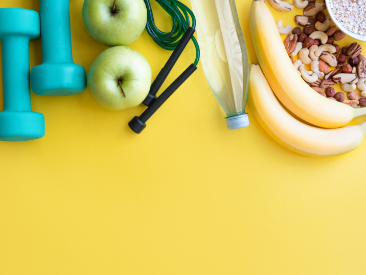 weights, fruit, on a yellow background