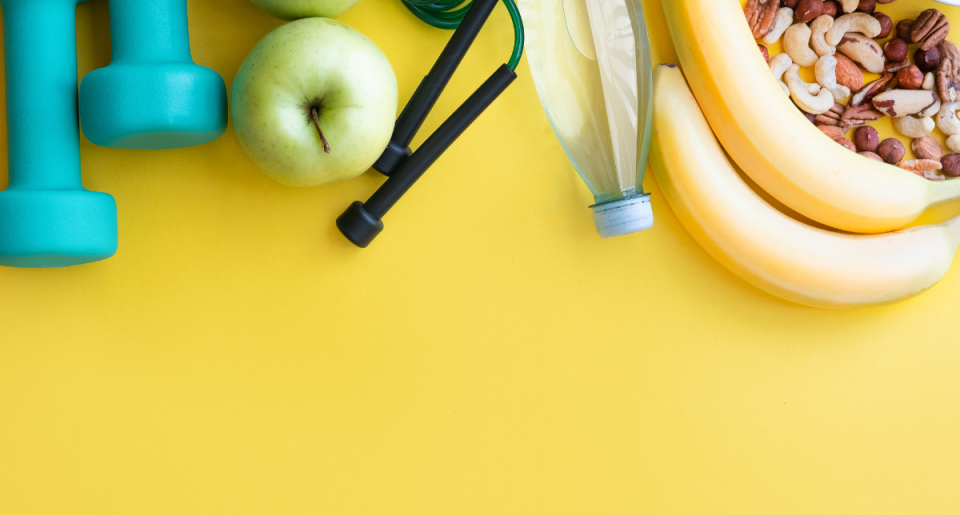 weights, fruit, on a yellow background